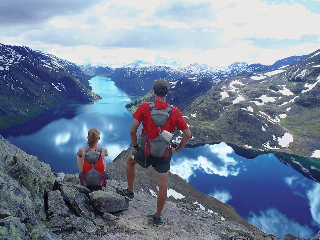 people hiking Besseggen ridge overlooking the lakes in Norway