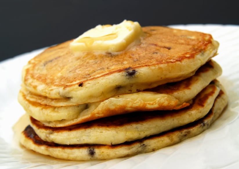 butter on chocolate chip pancakes