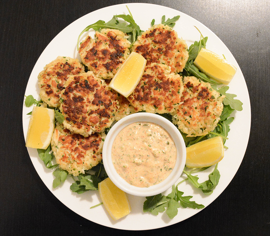 mini crab cakes with remoulade on a plate