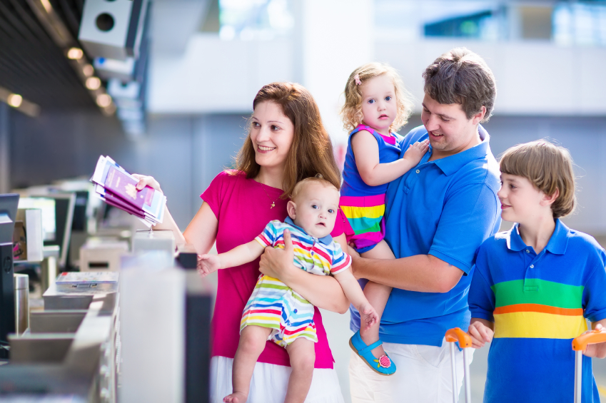 family arriving at the airport to check in