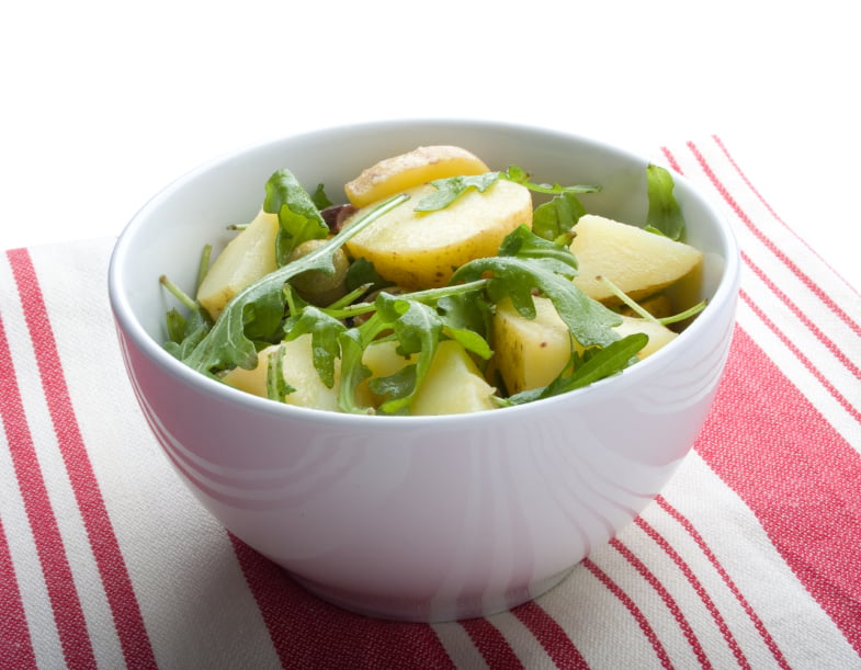 bowl filled with arugula and potato salad