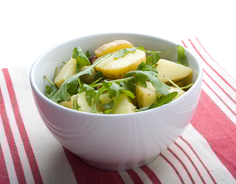 bowl filled with arugula and potato salad