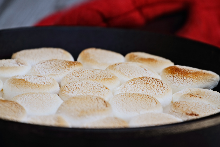 golden toasted marshmallows in a skillet s'mores dip