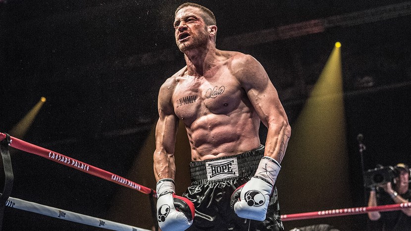 Jake Gyllenhaal, shirtless and wearing boxing gloves