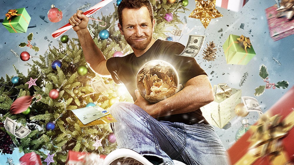 Kirk Cameron is holding a candy cane and jumping in Saving Christmas