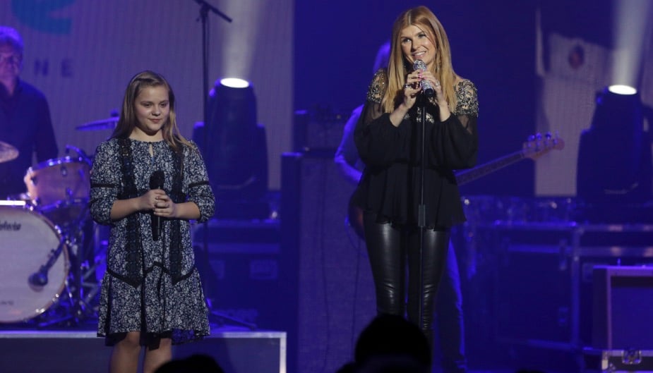 Connie Britton sings on stage in a scene from Nashville