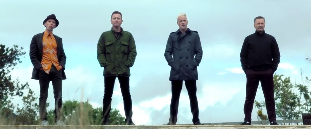 The cast of Trainspotting 2 standing in a field