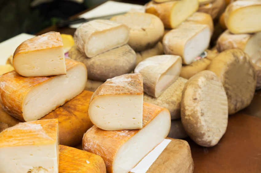 pile of cheese at a market display