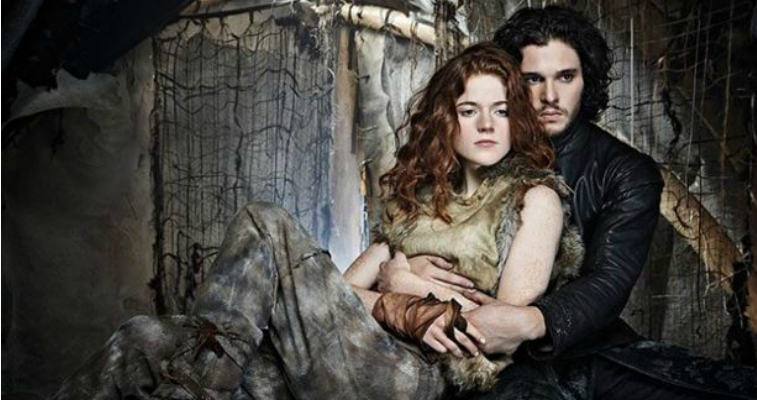 Jon Snow and Ygritte are cuddling together.