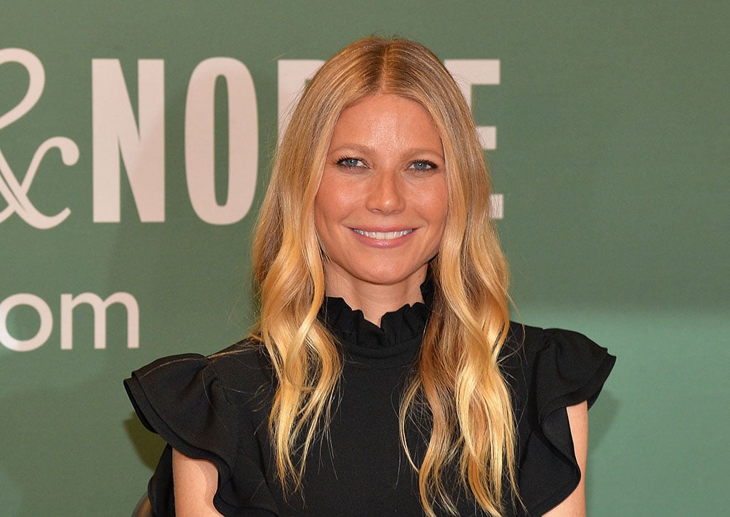 Gwyneth Paltrow poses for pictures at a book signing