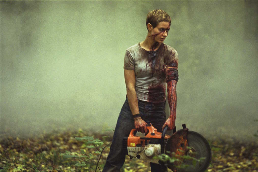 Marie (Cecile de France) stands with a buzzsaw in a scene from the French horror movie 'High Tension.'