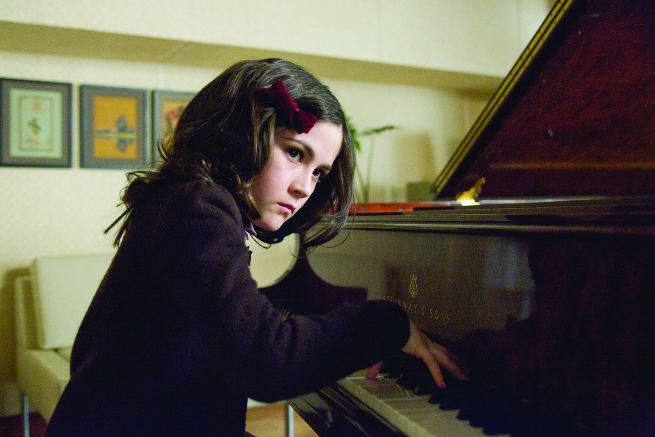 Esther (Isabelle Fuhrman) plays the piano in a scene from 'Orphan'