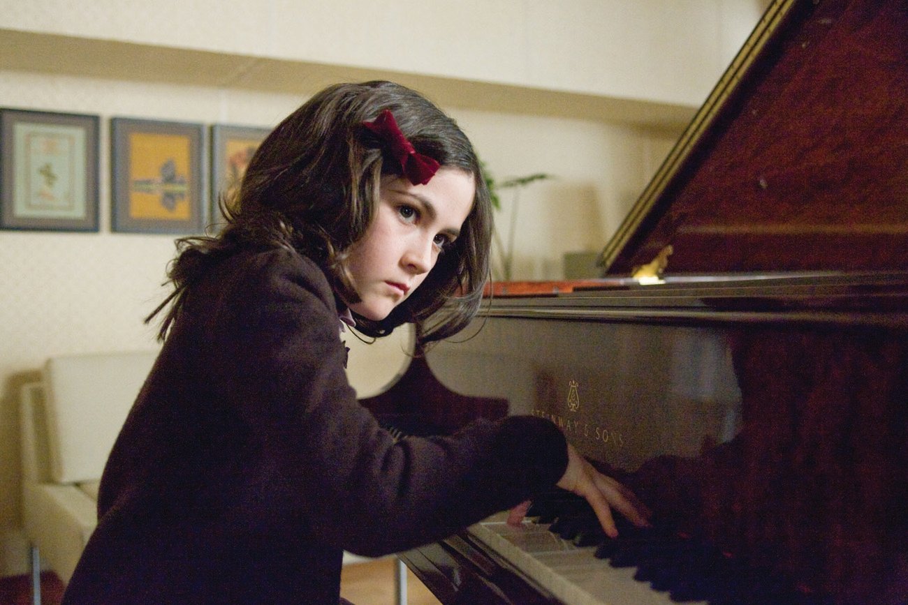 Esther (Isabelle Fuhrman) plays the piano in a scene from 'Orphan'