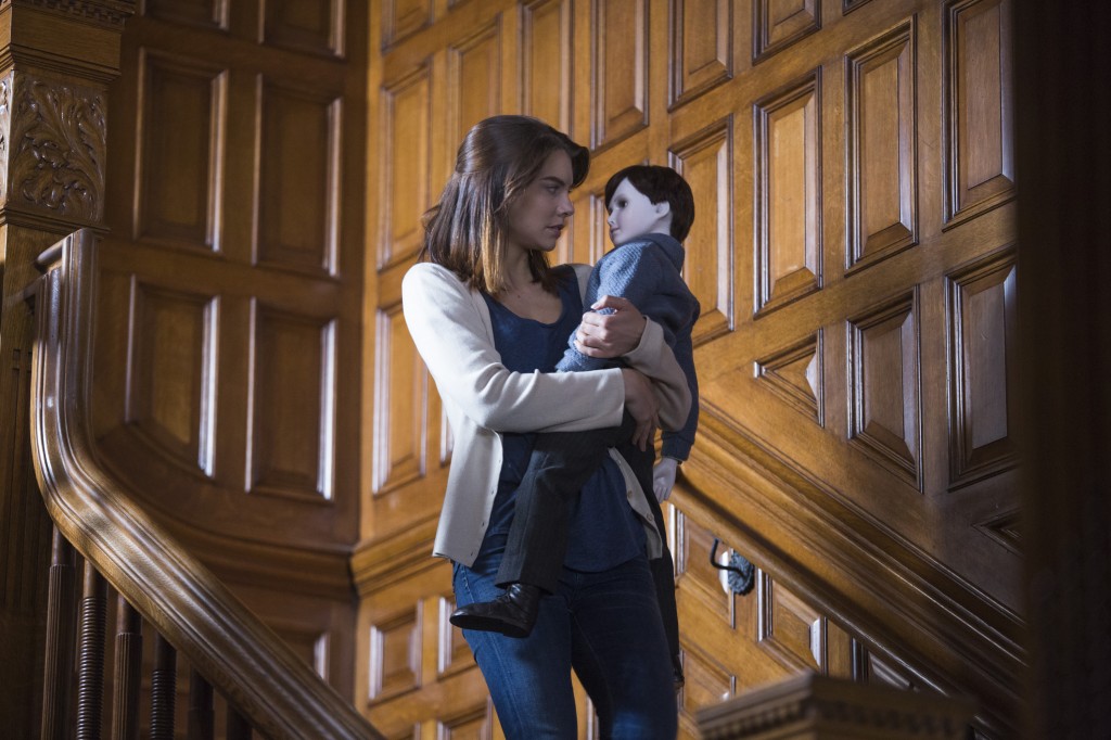 Greta (Lauren Cohan) carries Brahms the doll down the stairs in a scene from 'The Boy.'