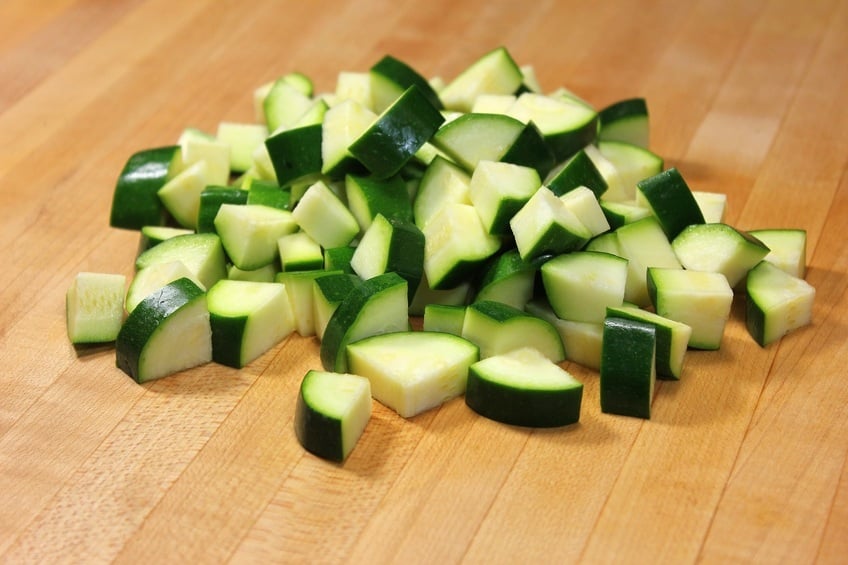 Chopped Zucchini on wooden board