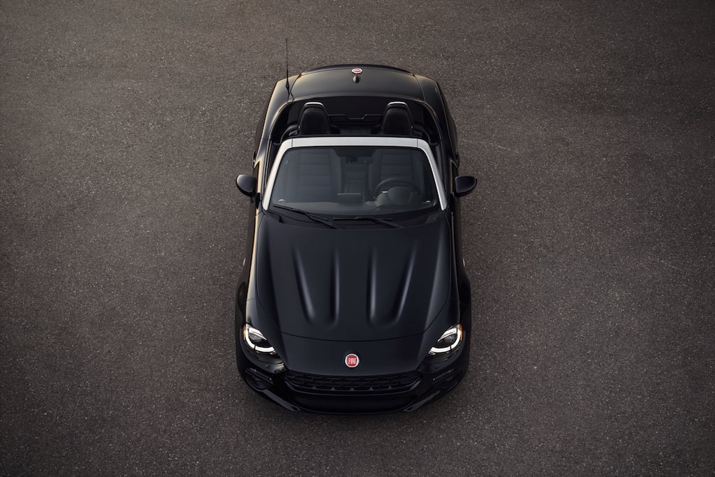 Aerial view of a black Fiat 124 Spider.