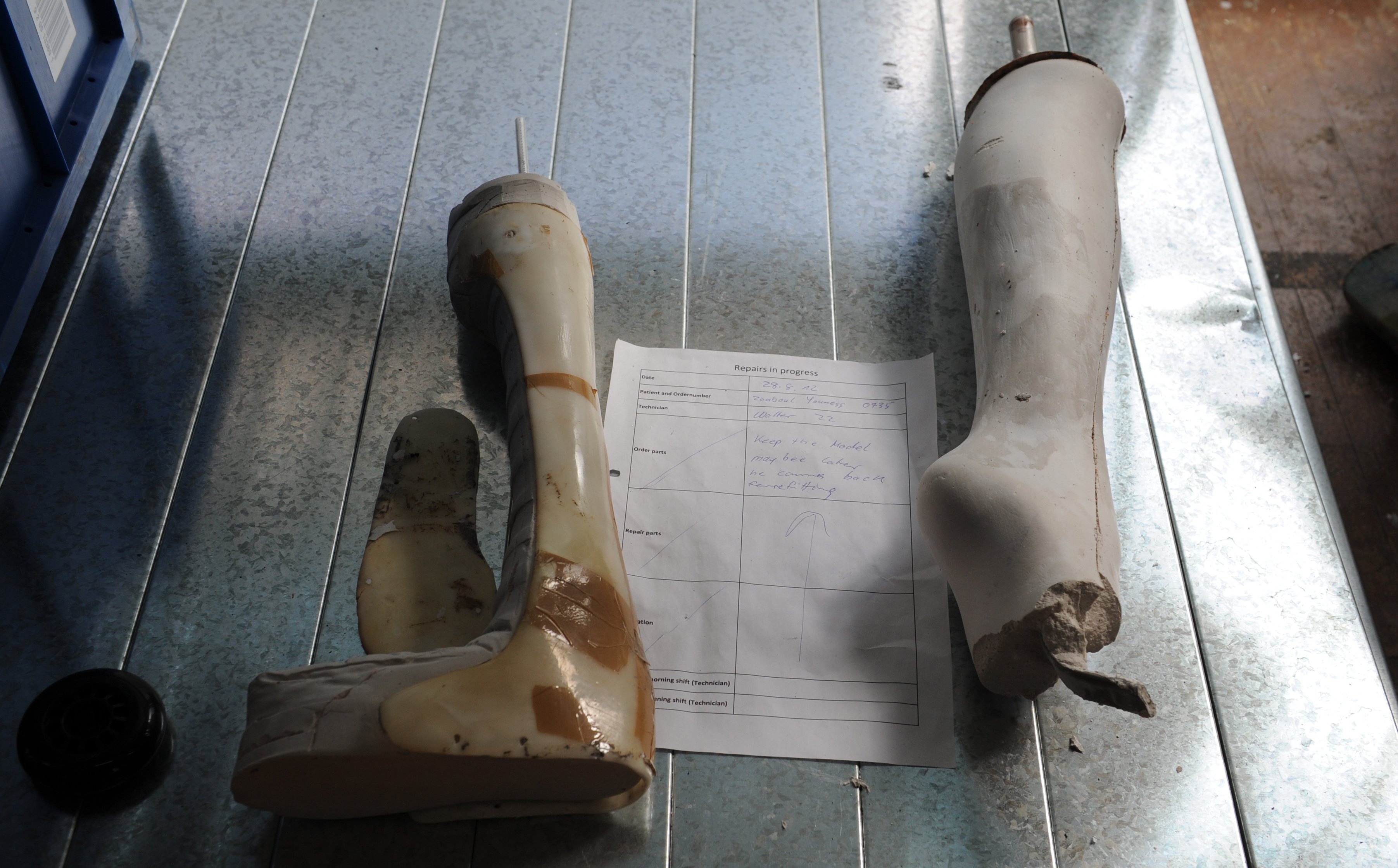 Repairs on athletes' prosthetic limbs are carried out in a workshop