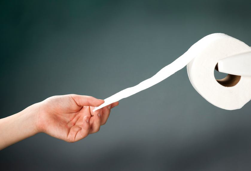 hand grabbing toilet paper