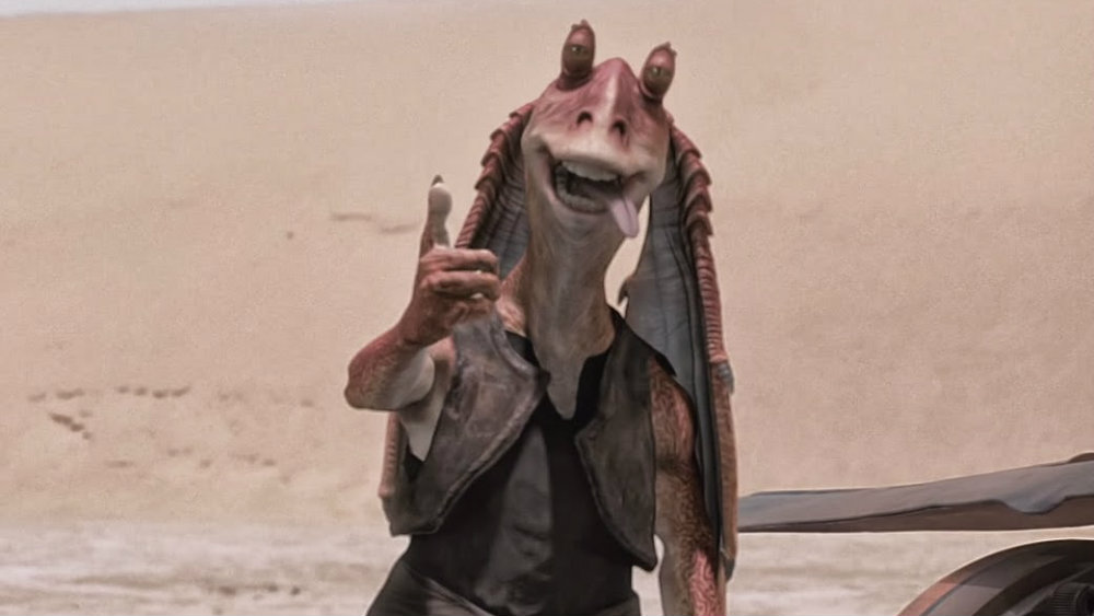 Jar Jar Binks with his thumb up and tongue lolling out of his mouth