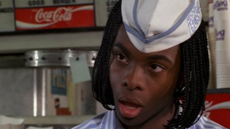 Kel Mitchell stands with his mouth open while wearing a white cap in a scene from Good Burger