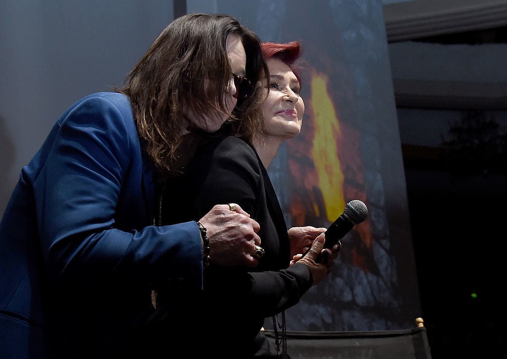 Ozzy Osbourne (L) and Sharon Osbourne holding microphone