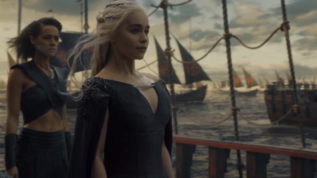 Daenerys Targaryen standing on a ship, looking off into the distance to the right of the frame