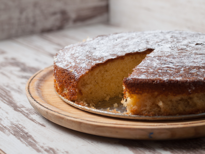 yellow cake with a slice missing