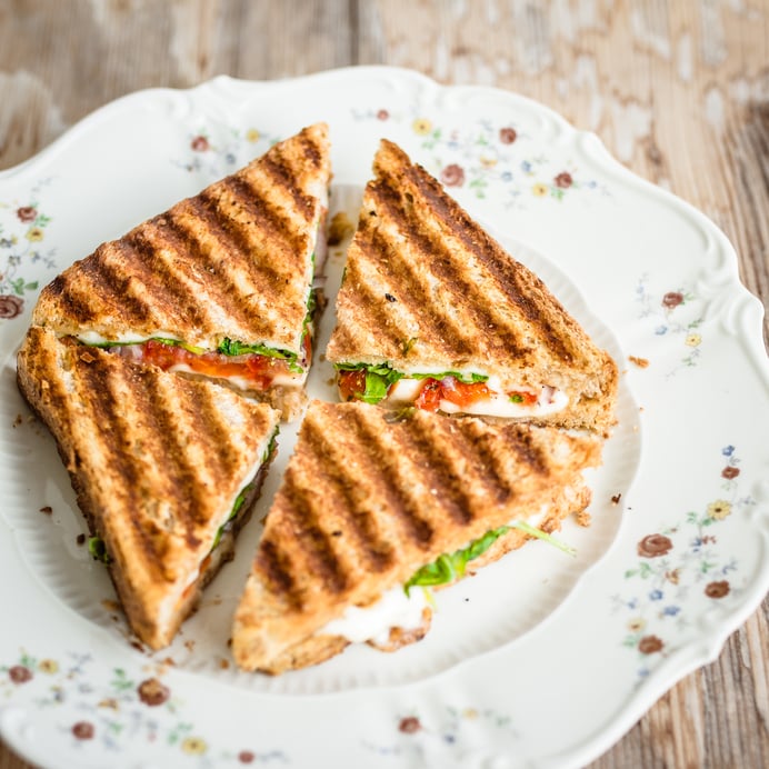Vegetarian panini cut into four pieces
