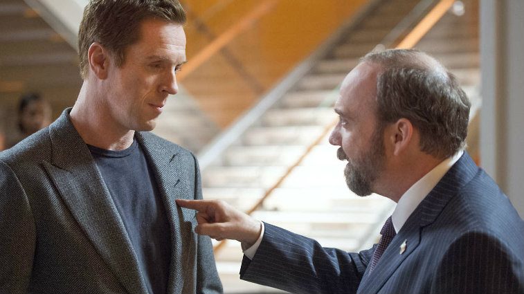 Damian Lewis and Paul Giamatti have a heated discussion in a scene from Billions