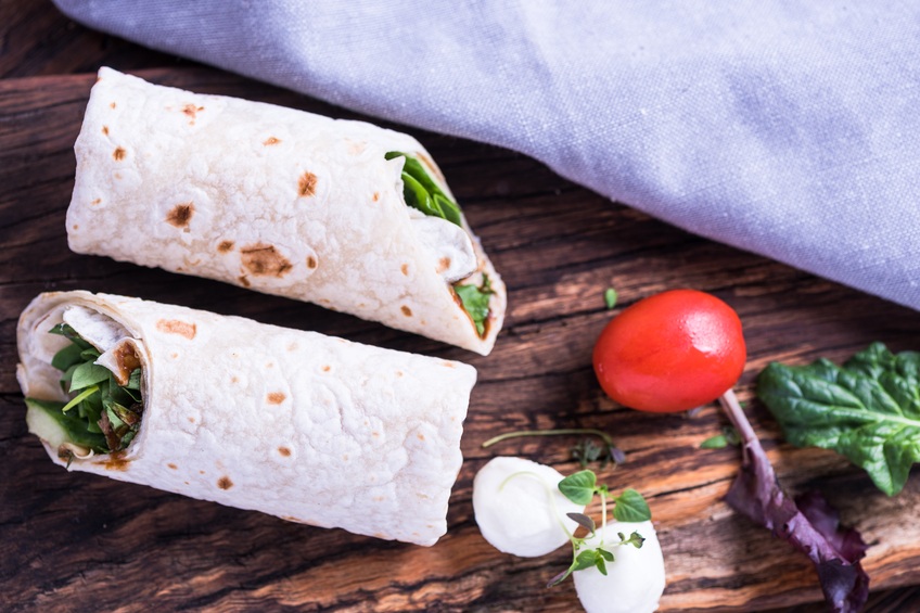 vegetable burritos on a table
