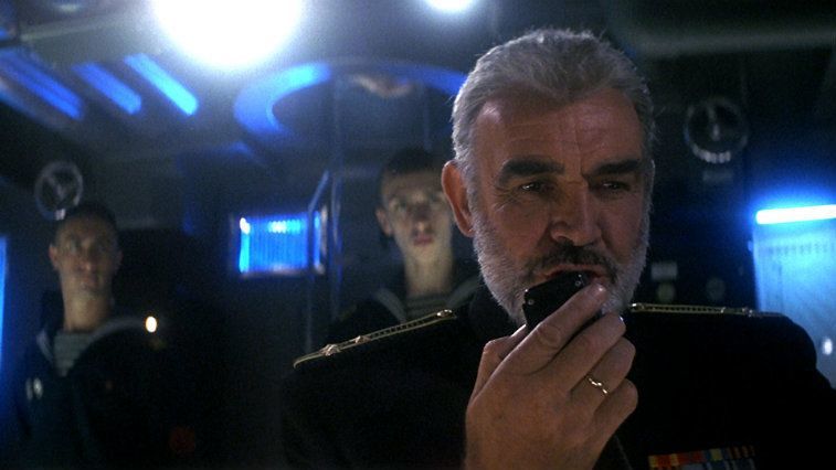 Sean Connery is talking into a walkie talkie in The Hunt for Red October