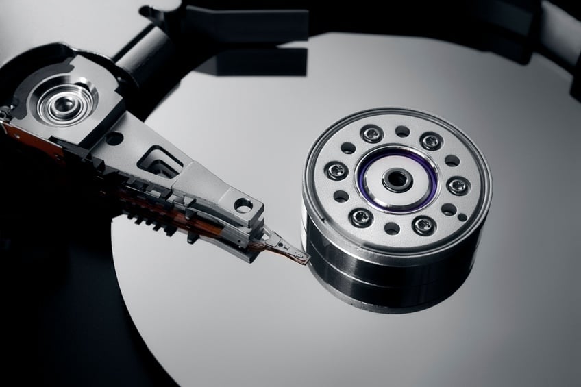 close-up-of-an-opened-hard-drive image An opened hard drive