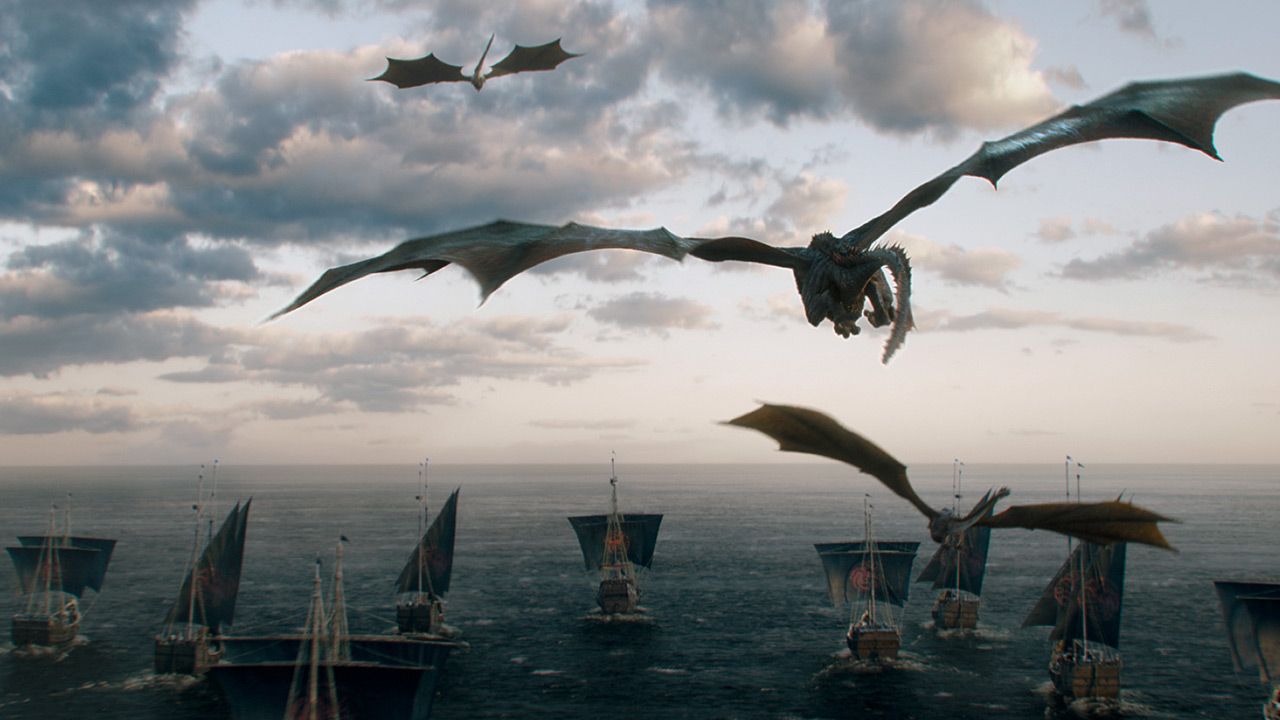 Dragons flying above a fleet of ships sailing away