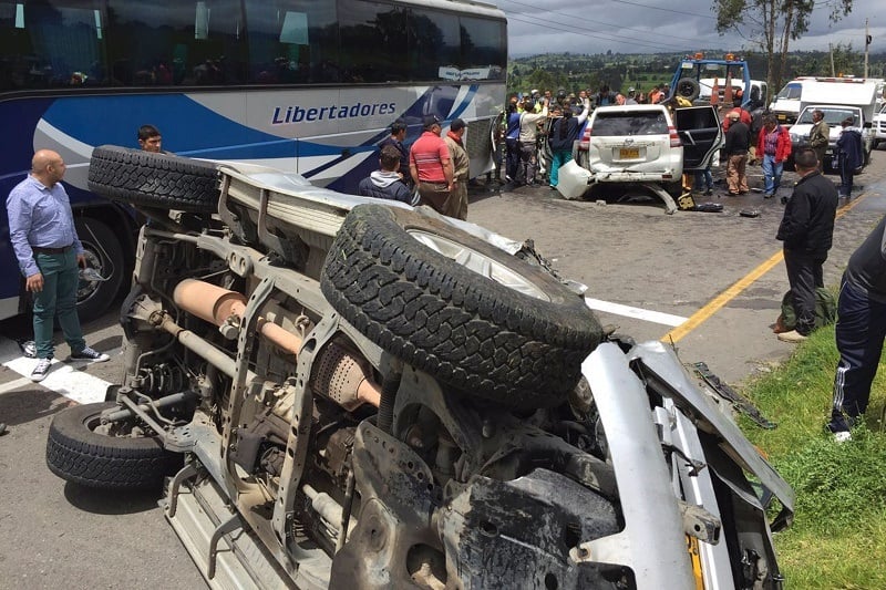 Riot police officers and other people assist the governor of Boyaca, Carlos Amaya (in vehicle), after a road accident between the cities of Tunja and Duitama, Boyaca Department, Colombia, on July 12, 2016. According to a statement released by Boyaca' Government press office citing witnesses, his caravan collided with "obstacles put in the way by striking truck drivers. / AFP / Edwin Camargo (Photo credit should read EDWIN CAMARGO/AFP/Getty Images)