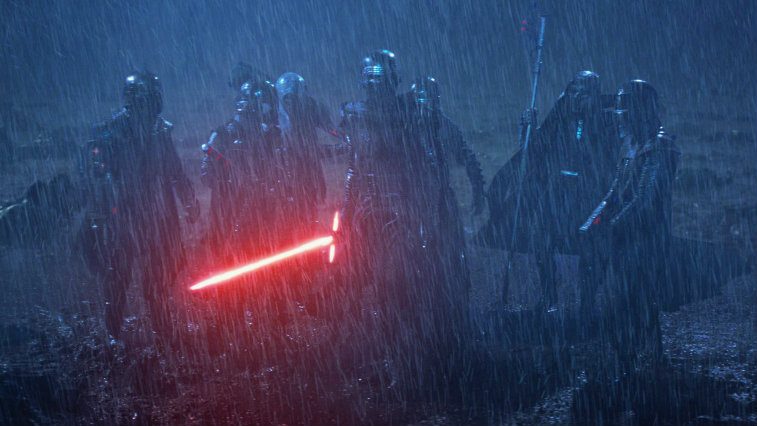 The Knights of Ren, gathered together in a rainstorm, clad in all black