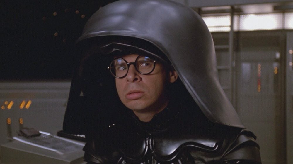 Rick Moranis in Spaceballs in a Darth Vader looking suit and helmet