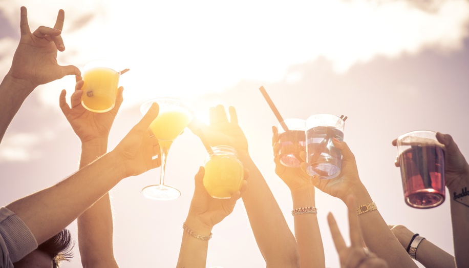 Labor Day, hands to the sky with cocktails