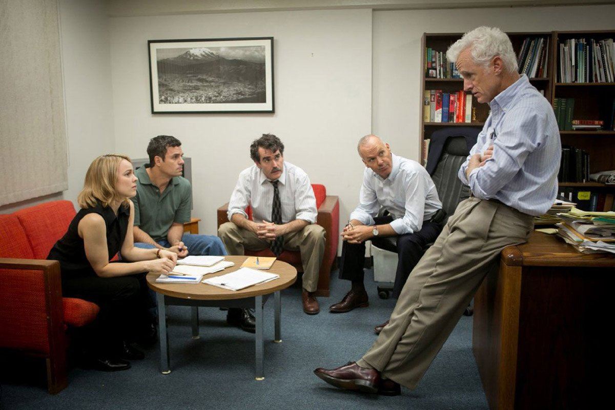 Journalists sitting in a room together talking in Spotlight