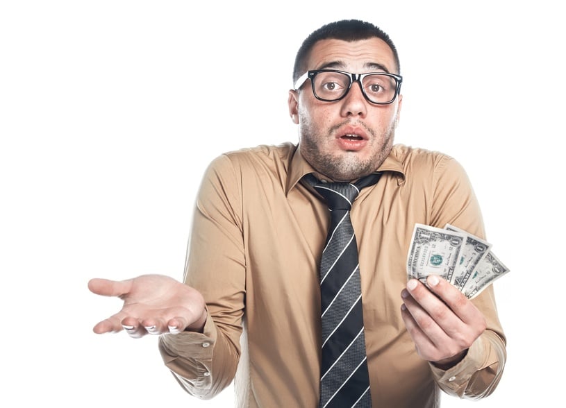 Confused person holding money