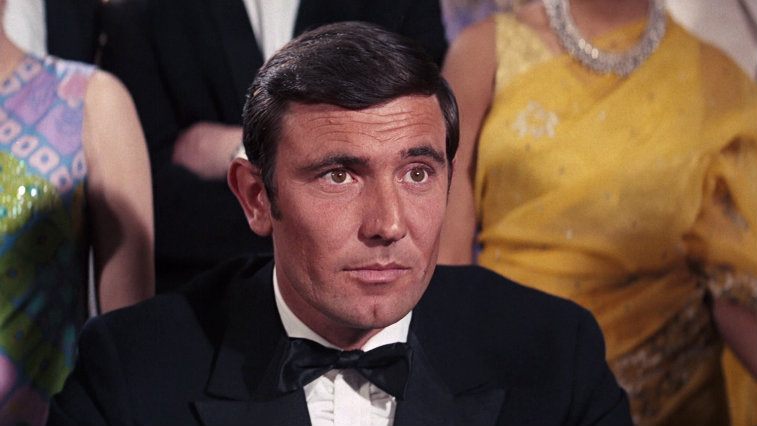 George Lazenby sits in a tux as James Bond as On Her Majesty's Secret Service