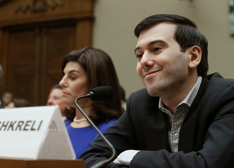 WASHINGTON, DC - FEBRUARY 04: Martin Shkreli, former CEO of Turing Pharmaceuticals LLC., smiles while flanked by Nancy Retzlaff, chief commercial officer for Turing Pharmaceuticals LLC., during a House Oversight and Government Reform Committee hearing on Capitol Hill, February 4, 2016 in Washington, DC. Shkreli invoked his 5th Amendment right not to testify to the committee that is examining the prescription drug market. (Photo by Mark Wilson/Getty Images)