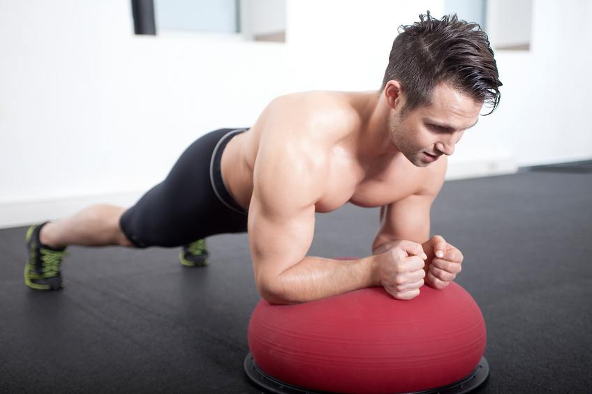 Male athlete performing a plank