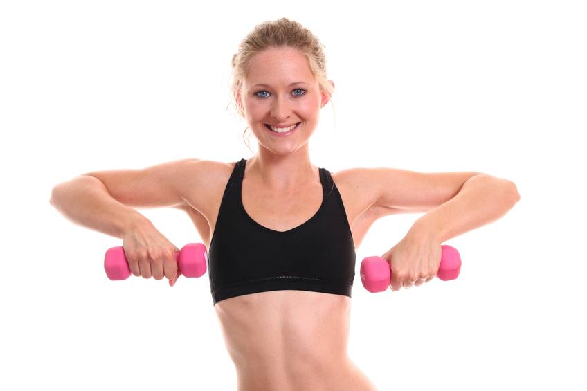 A female gym instructor demonstrating an upright row