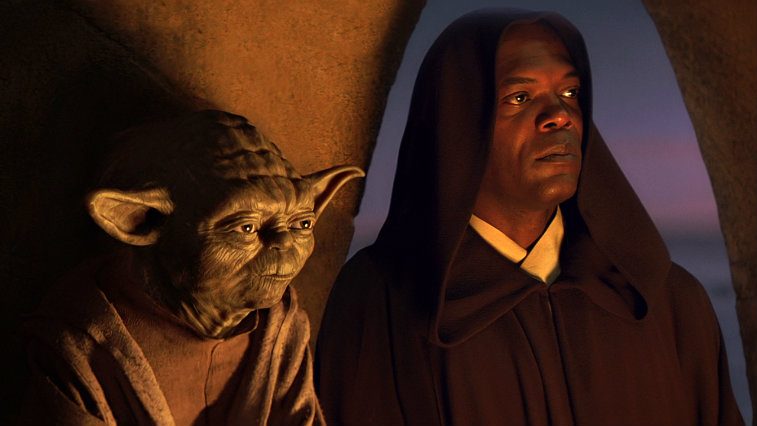 Yoda and Samuel L Jackson in Star Wars Episode I The Phantom Menace, with Jackson wearing a brown robe with a hood, lit by a fire