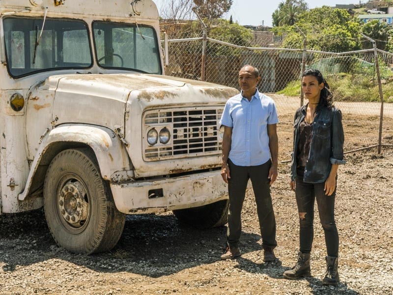 Luciana (Danay Garcia) and Alejandro (Paul Calderon) stand by a broken down bus in a scene from AMC's 'Fear the Walking Dead'