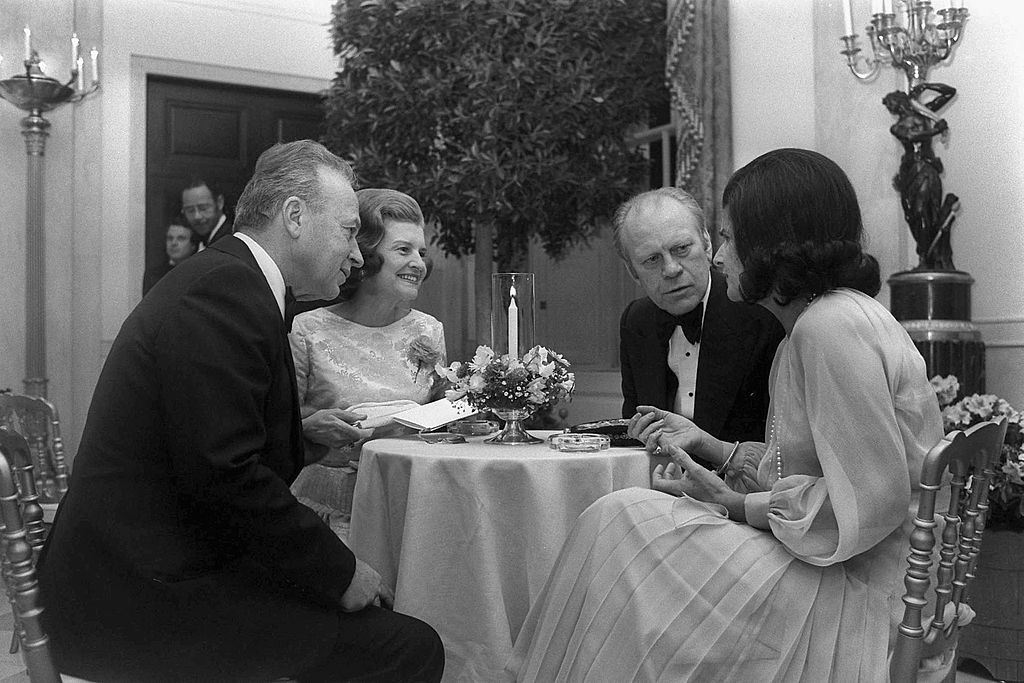 U.S. President Gerald Ford (2nd R) and his wife Betty Ford (2nd L) have dinner with Israeli Prime Minister