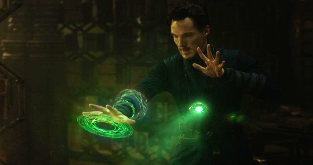 Doctor Strange with green rings around his right arm, casting a spell with the Time Stone