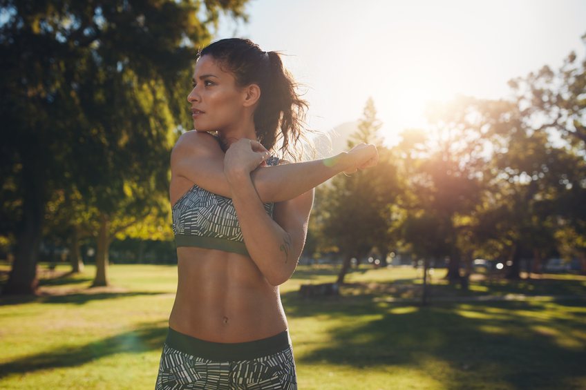 female athlete stretching before fitness female athlete stretching before fitness