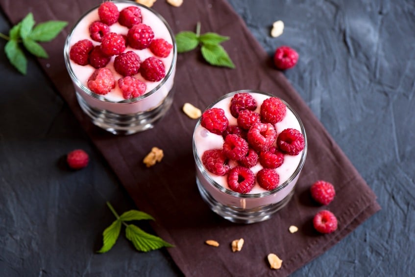 organic fresh parfait dessert with raspberries and granola