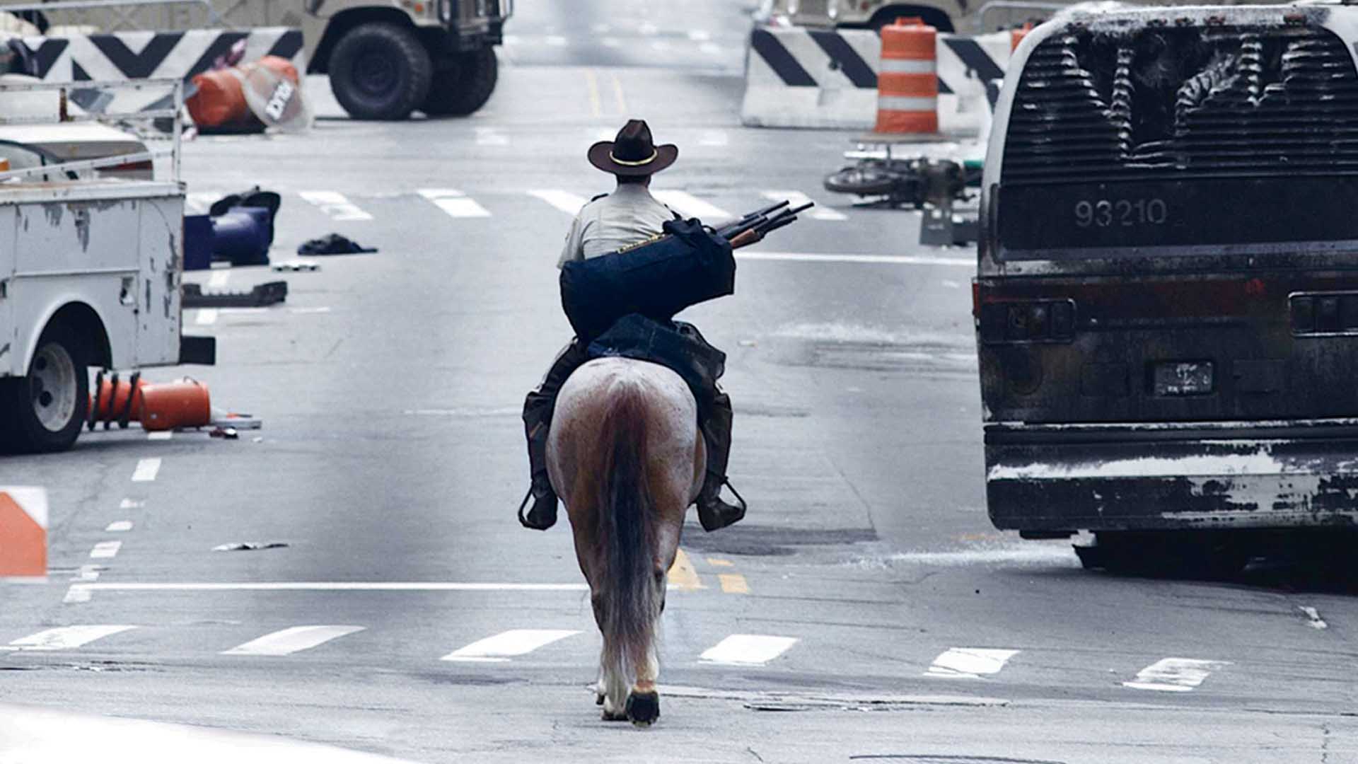 Rick Grimes (Andrew Lincoln) rides his horse through an abandoned Atlanta in a scene from Season 1 of 'The Walking Dead'